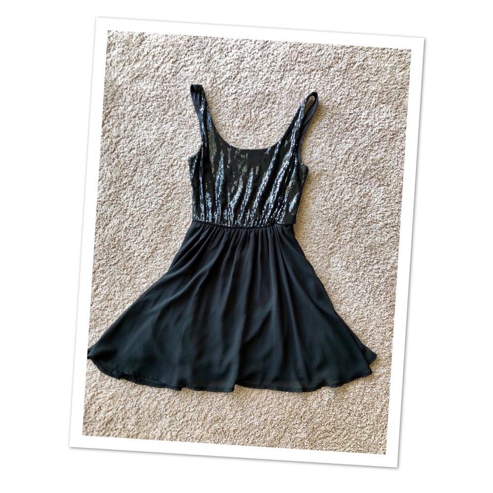 Nollie black sequin dress.